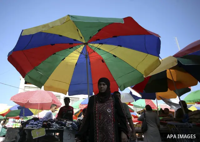 Palestinians shop at a traditional market on the fifth day of the holy month of Ramadan in the West Bank city of Ramallah on August 15,2010. Devout Muslims refrain from eating, drinking and smoking from dawn to dusk duri...