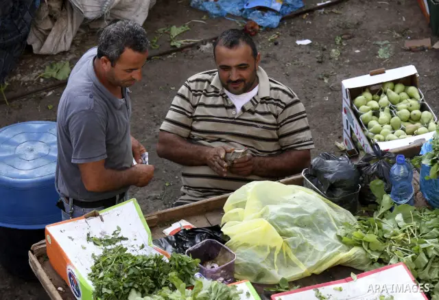 Palestinians shop at a traditional market on the fifth day of the holy month of Ramadan in the West Bank city of Ramallah on August 15,2010. Devout Muslims refrain from eating, drinking and smoking from dawn to dusk duri...