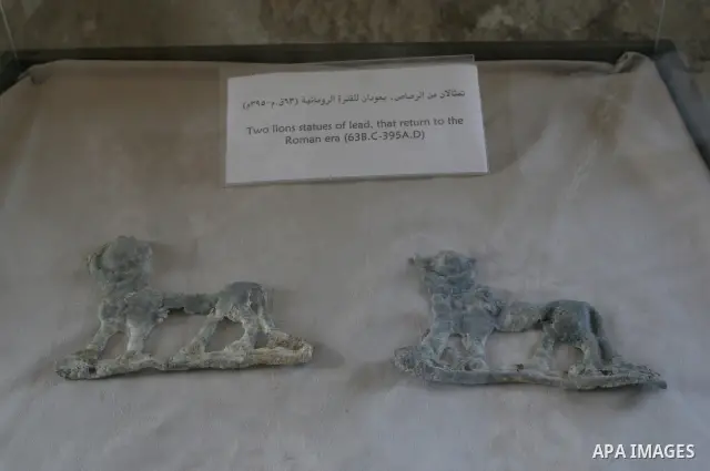 Palestinians look at the ancient antiquities in the ancient Basha's Palace museum during the opening of fence and gate Basha's Palace in Gaza City on August 16, 2010. The Basha's Palace stands out as a building of histor...