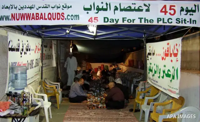 Palestinian lawmakers from Hamas movements Ahmed Atwan, Khaled Abu Arafieh and Muhammad Totah sit on the seventh day of the holy month of Ramadan at the International Red Cross Committee (ICRC), headquarter in East Jerus...