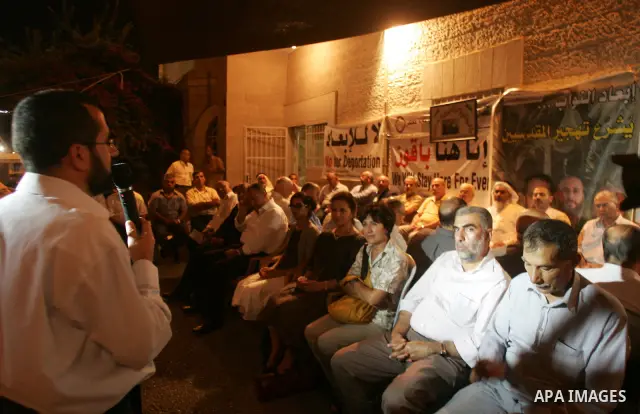 Palestinians support the lawmakers from Hamas movements Ahmed Atwan, Khaled Abu Arafieh and Muhammad Totah at the International Red Cross Committee (ICRC), headquarter in East Jerusalem August 19,2010. The Hamas lawmaker...