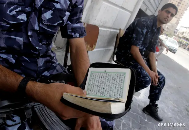 Palestinian Hamas policemen stand guards in a street in Gaza City on August 21, 2010. The Palestinian government in Gaza Strip announced to collect non-licensed weapons. Photo by Mohammed Asad