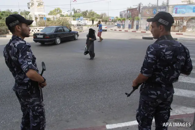 Palestinian Hamas policemen stand guards in a street in Gaza City on August 21, 2010. The Palestinian government in Gaza Strip announced to collect non-licensed weapons. Photo by Mohammed Asad