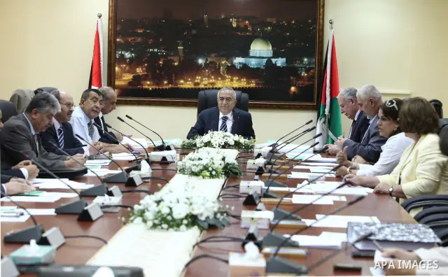Palestinian Prime Minister Salam Fayyad heads the Palestinian cabinet meeting in the West Bank city of Ramallah on August 23,2010. Photo by Mustafa Abu Dayeh \ pool