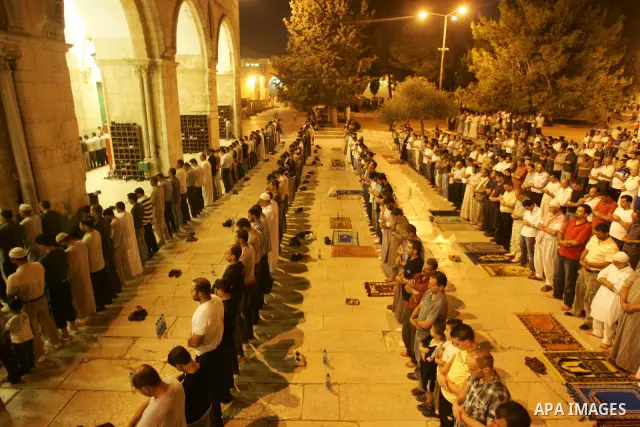 Muslims pray in front of Al-Aqsa mosque on the compound known to Muslims as al-Haram al-Sharif and to Jews as Temple Mount during on the thirteenth day of the holy month of Ramadan in Jerusalem's Old City August 23, 2010...