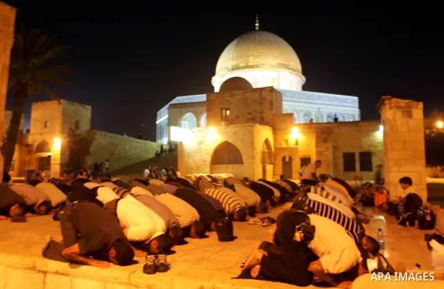 Muslims pray in front of the Dome of the Rock on the compound known to Muslims as al-Haram al-Sharif and to Jews as Temple Mount during on the thirteenth day of the holy month of Ramadan in Jerusalem's Old City August 23...