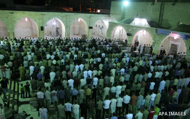 Palestinians pray al-Taraweh prayers at Al-Omari mosque during the holy month of Ramadan, in Gaza City, August 25, 2010. Muslims abstain from drinking, eating and having sex during Ramadan from dawn till dusk. . Photo by...