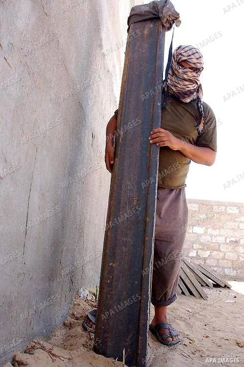 A Palestinian smuggler cuts the metal sheets underground along the border between Egypt and the southern Gaza Strip town of Rafah on August 26,2010. Egyptian Authorities constructed the metal sheets in an apparent attemp...