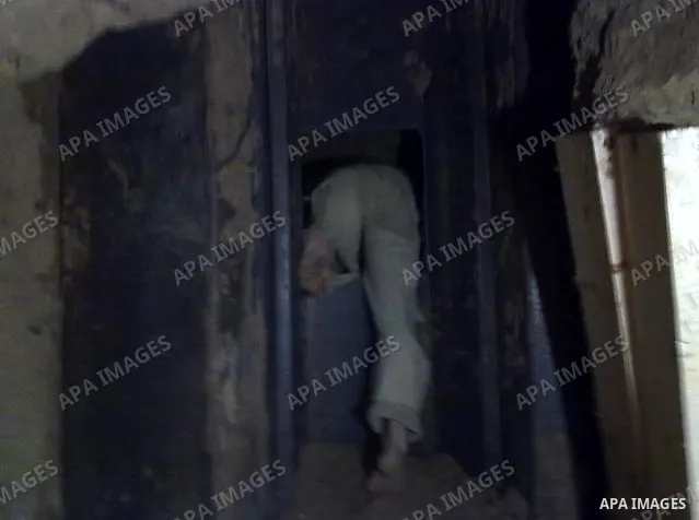 A Palestinian smuggler cuts the metal sheets underground along the border between Egypt and the southern Gaza Strip town of Rafah on August 26,2010. Egyptian Authorities constructed the metal sheets in an apparent attemp...