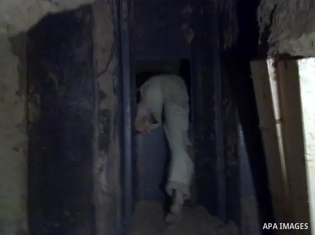 A Palestinian smuggler cuts the metal sheets underground along the border between Egypt and the southern Gaza Strip town of Rafah on August 26,2010. Egyptian Authorities constructed the metal sheets in an apparent attemp...