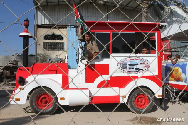 Palestinians display a local-made train near their workshop in Gaza city on August 30,2010. The train consider the first in the enclave Gaza Strip. Photo by Ashraf Amra