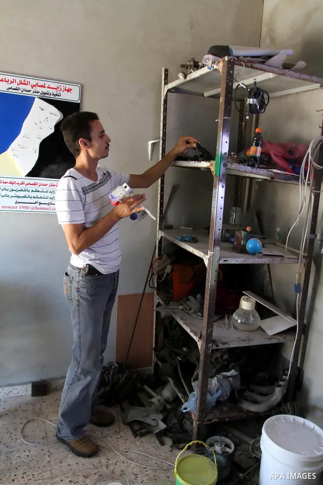 Monzer al-Qasas, a Palestinian inventor who works on electronic machine for the disabled, is seen at his home in Gaza City, on August 31, 2010. The 30-year-old man invents electronic machines to help the disabled who hav...