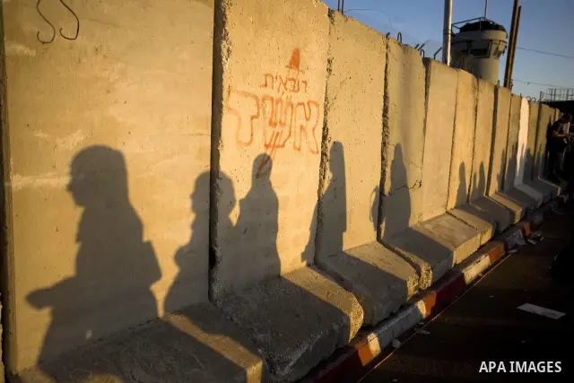 Palestinian women wait to cross at Kalandia checkpoint between Jerusalem and the West Bank city of Ramallah, to pray at al-Aqsa mosque on the last Friday of the holy month of Ramadan, Sept. 3, 2010. Muslims throughout th...