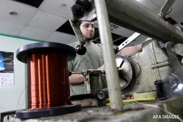 A Palestinian youth Farouk Sharaf prepares electric charger at his workshop in Gaza City on Sept 4,2010 as Gaza Strip which suffers from power outages as the lack of fuel to Gaza's power station in the city . Photo by As...