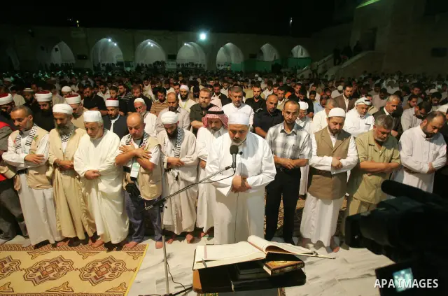 Palestinian Prime Minister in Gaza Strip, Ismail Haniyeh performs al-Taraweh prayers at the al-Omari mosque during the holy month of Ramadan in Gaza city on Sept. 4,2010. Photo by Ali Jadallah