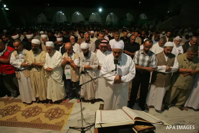 Palestinian Prime Minister in Gaza Strip, Ismail Haniyeh performs al-Taraweh prayers at the al-Omari mosque during the holy month of Ramadan in Gaza city on Sept. 4,2010. Photo by Ali Jadallah
