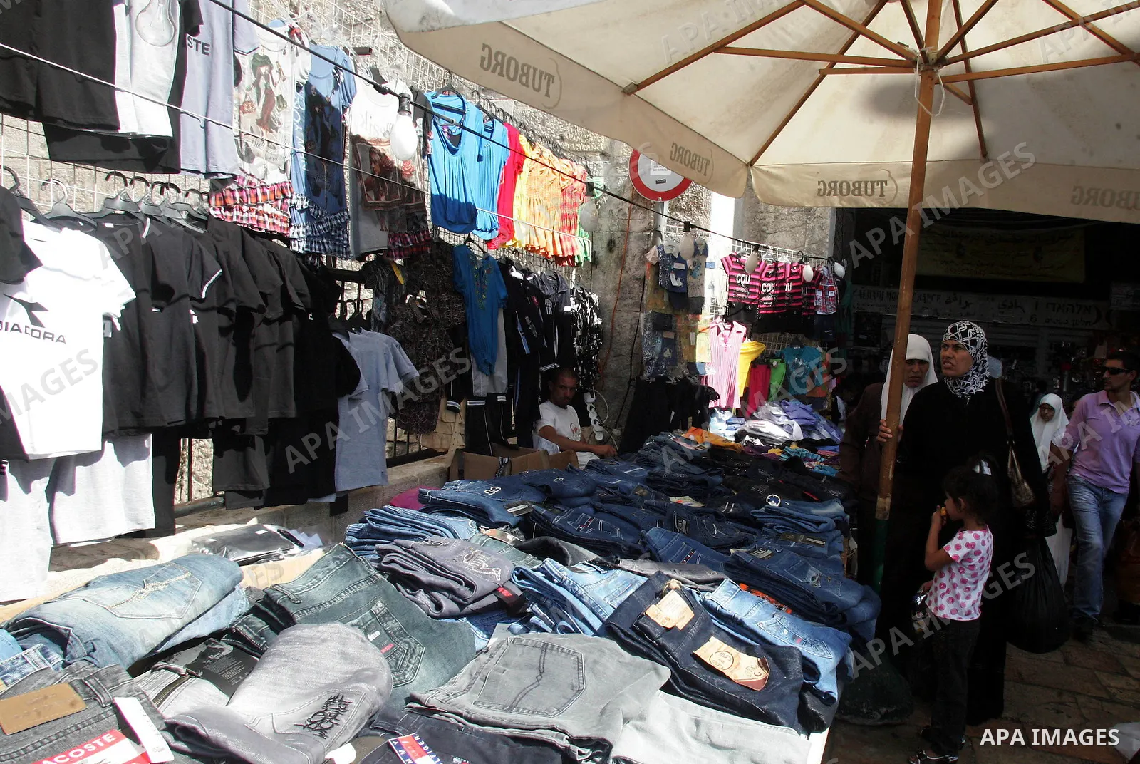 Palestinians shop outside of Damascus Gate ahead of the upcoming celebration of Eid al-Fitr, marking the end of the Muslim holy month of Ramadan in Jerusalem's Old City September 8, 2010. Photo by Mahfouz Abu Turk