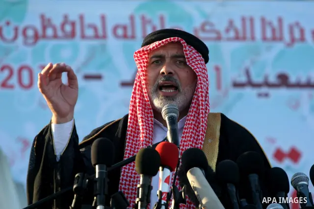 Palestinian Prime Minister in Gaza Strip, Ismail Haniyeh attends the early morning Eid Al-Fitr prayer in the northern Gaza Strip on September 9, 2010. Muslims across the world are celebrating the first day of Eid al-Fitr...