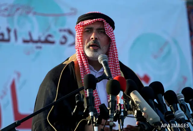 Palestinian Prime Minister in Gaza Strip, Ismail Haniyeh attends the early morning Eid Al-Fitr prayer in the northern Gaza Strip on September 9, 2010. Muslims across the world are celebrating the first day of Eid al-Fitr...
