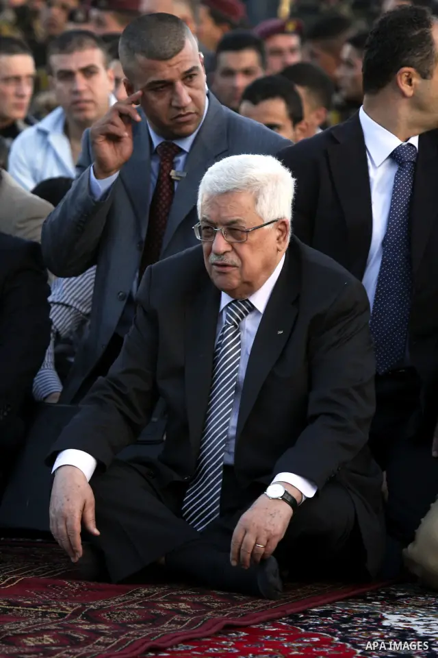 Palestinian president Mahmud Abbas and prime minister Salam Fayyad perform the early morning Eid Al-Fitr prayer at the Palestinian Authority headquarters in the West Bank city of Ramallah on September 10, 2010 . Muslims...