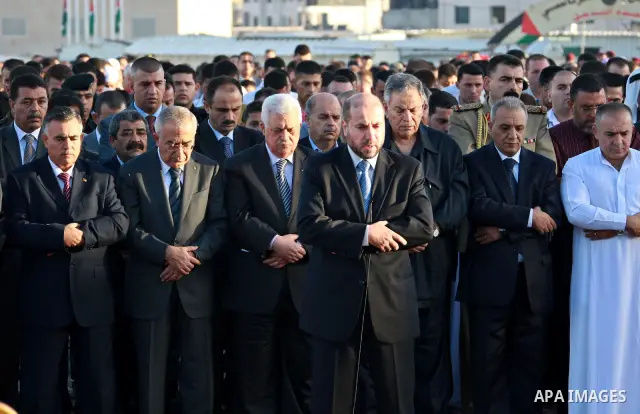 Palestinian president Mahmud Abbas and prime minister Salam Fayyad attend the early morning Eid Al-Fitr prayer at the Palestinian Authority headquarters in the West Bank city of Ramallah on Sept. 10, 2010 . Muslims acros...