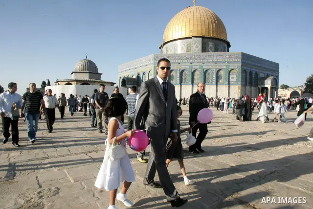 Palestinian Muslims in the courtyards of Al-Aqsa Mosque compound during the first day of Eid al-Fitr which marks the end of the Muslim fasting month of Ramadan, in the Al Aqsa Mosque Compound in Jerusalem's Old City, Fri...