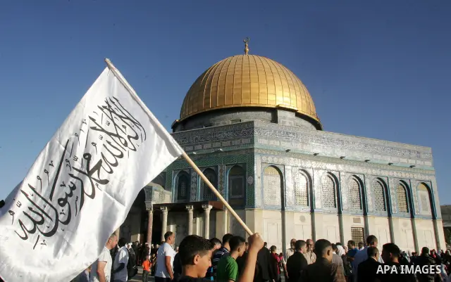 Palestinian Muslims in the courtyards of Al-Aqsa Mosque compound during the first day of Eid al-Fitr which marks the end of the Muslim fasting month of Ramadan, in the Al Aqsa Mosque Compound in Jerusalem's Old City, Fri...