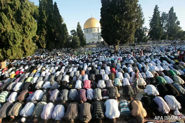Palestinians pray on the first day of Eid al-Fitr, which marks the end of the holy month of Ramadan, inside the Al-Aqsa mosque, on the compound known to Muslims as al-Haram al-Sharif and to Jews as Temple Mount, in Jerus...