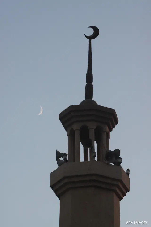 The moon is seen near a minaret in Gaza city on Sept. 12,2010. Photo by Mohammed Asad