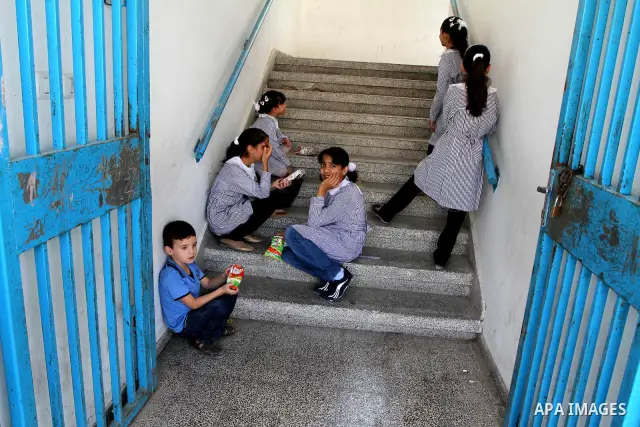 Palestinian students return to their school of the (UNRWA) in the first day of new school year in in Deir al-Balah ,central Gaza Strip on Sept. 14, 2010. The academic year began in the Gaza Strip on Sept. 14 . Photo by A...