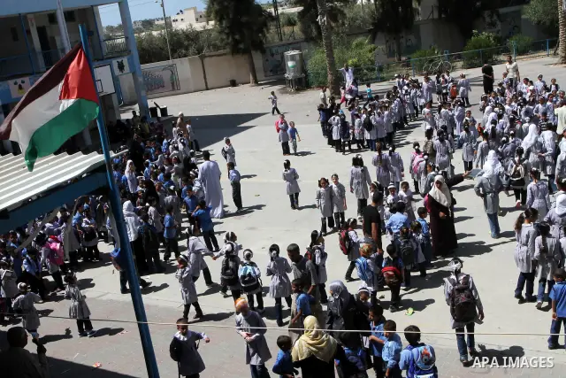 Palestinian students return to their school of the (UNRWA) in the first day of new school year in in Deir al-Balah ,central Gaza Strip on Sept. 14, 2010. The academic year began in the Gaza Strip on Sept. 14 . Photo by A...