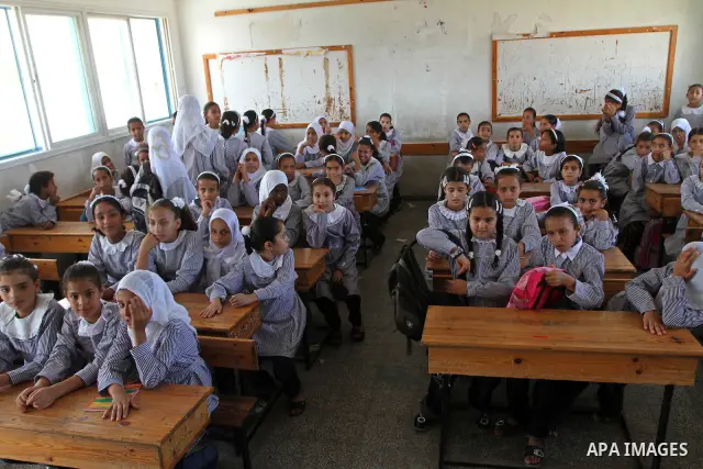Palestinian students return to their school of the (UNRWA) in the first day of new school year in in Deir al-Balah ,central Gaza Strip on Sept. 14, 2010. The academic year began in the Gaza Strip on Sept. 14 . Photo by A...