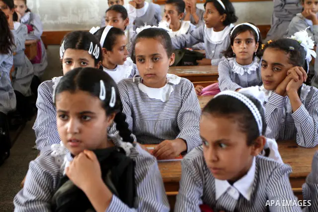 Palestinian students return to their school of the (UNRWA) in the first day of new school year in in Deir al-Balah ,central Gaza Strip on Sept. 14, 2010. The academic year began in the Gaza Strip on Sept. 14 . Photo by A...