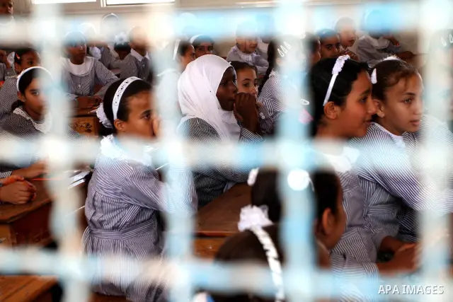 Palestinian students return to their school in the first day of new school year in Deir al-Balah ,central Gaza Strip on Sept. 14, 2010. The academic year began in the Gaza Strip on Sept. 14 . Photo by Ashraf Amra
