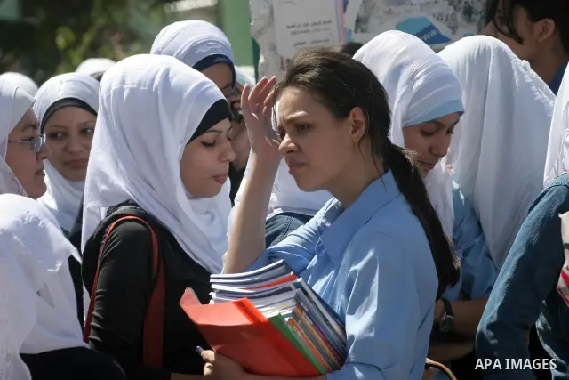 Palestinian students return to their school in the first day of new school year in Gaza Strip on Sept. 14, 2010. The academic year began in the Gaza Strip and West Bank on Sept. 14 . Photo by Mohammed Asad