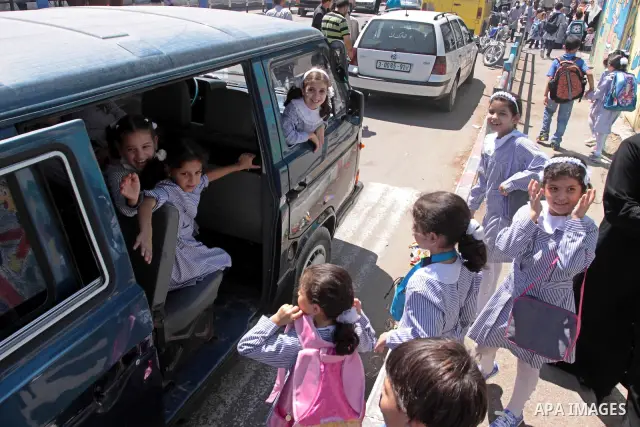 Palestinian students return to their school in the first day of new school year in Gaza Strip on Sept. 14, 2010. The academic year began in the Gaza Strip and West Bank on Sept. 14 . Photo by Mohammed Asad