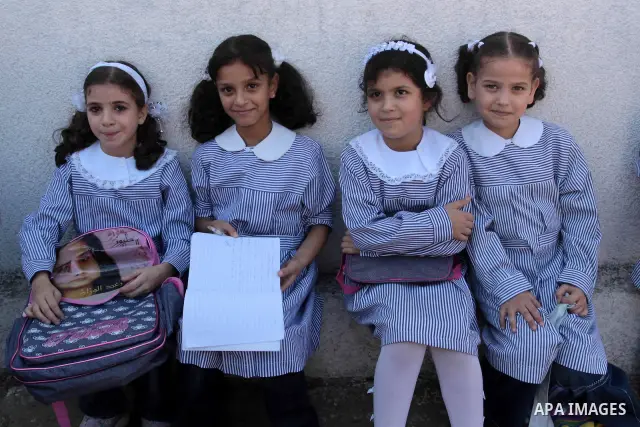 Palestinian students return to their school in the first day of new school year in Gaza Strip on Sept. 14, 2010. The academic year began in the Gaza Strip and West Bank on Sept. 14 . Photo by Mohammed Asad