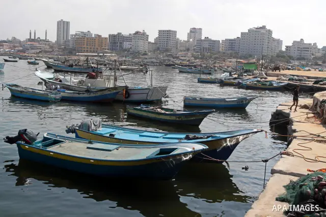 A Palestinian boy enjoys swimming at the port of Gaza city on Sept. 16, 2010 . Photo by Mohammed Asad