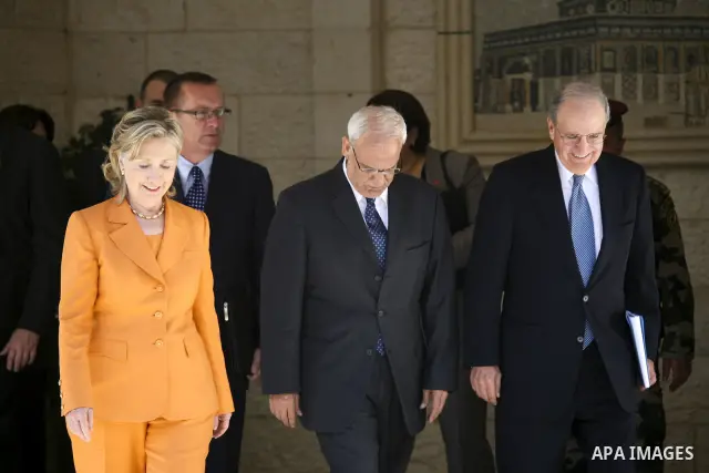 Secretary of State Hillary Rodham Clinton, left, walks with Palestinian senior negotiator Saeb Erekat, right, after their meeting with Palestinian president Mahmoud Abbasin the West Bank city of Ramallah on Sept. 16, 201...
