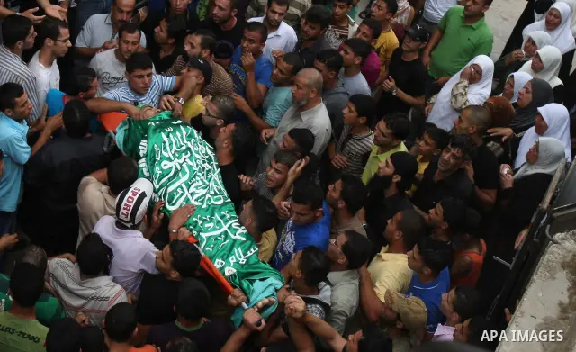Mourners carry the body of Eyad Shilbaya, a 38-year-old local leader of the armed wing of the Islamist movement Hamas, who was shot dead by Israeli soldiers who was shot dead by Israeli soldiers on September 17, 2010 ins...