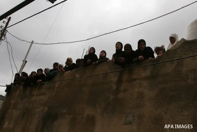Family friends and relatives of Iyad Shilbaya, a 38-year-old local leader of the armed wing of the Islamist movement Hamas, mourn at his home after he was shot dead by Israeli soldiers on September 17, 2010 inside his be...