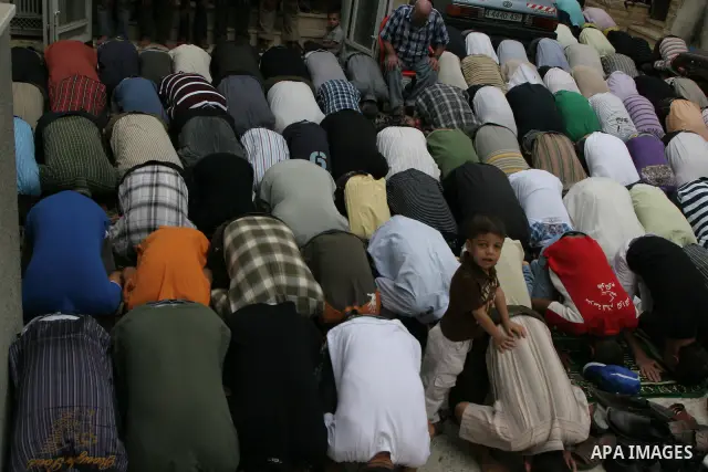Palestinian mourners pray during the funeral of Eyad Shilbaya, a 38-year-old local leader of the armed wing of the Islamist movement Hamas, after he was shot dead by Israeli soldiers on September 17, 2010 inside his bedr...