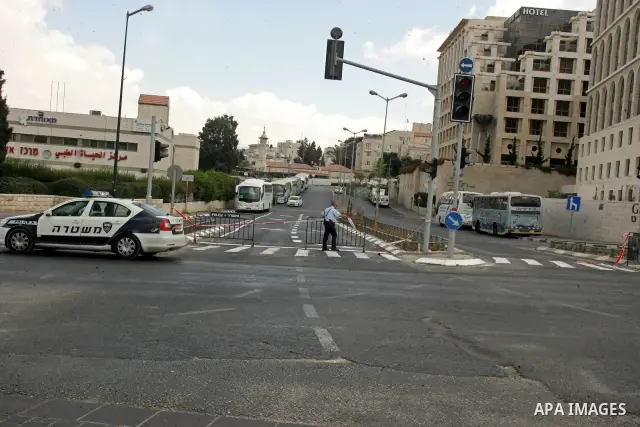 An Israeli police officer walk in the middle of an empty street during the Jewish holiday of Yom Kippur in Jerusalem's Old City Sept. 18, 2010. Yom Kippur, or Day of Atonement, which starts at sundown tomorrow, is the ho...