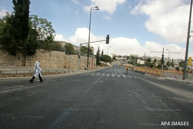 An Ultra orthodox Jewish walks in empty street during the Jewish holiday of Yom Kippur in Jerusalem's Old City Sept. 18, 2010. Yom Kippur, or Day of Atonement, which starts at sundown tomorrow, is the holiest of Jewish h...