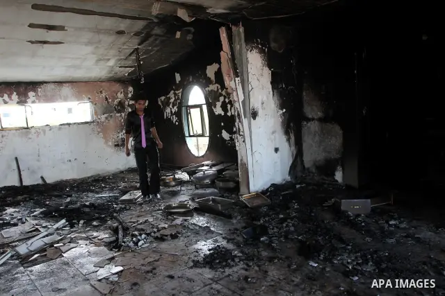 A Palestinian man inspects a burnt out hall at Crazy Water Park in Gaza City on Sept. 19, 2010 . Masked gunman torched the three-month-old entertainment park in the Hamas-run Gaza Strip on Sunday after neutralizing guard...