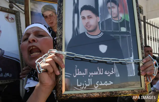 Palestinian women and children protest calling for the release of their relatives from Israeli jails, on Sept. 19, 2010, in the northern Israeli occupied West Bank city of Nablus . More than 7,000 Palestinians, including...