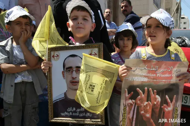 Palestinian women and children protest calling for the release of their relatives from Israeli jails, on Sept. 19, 2010, in the northern Israeli occupied West Bank city of Nablus . More than 7,000 Palestinians, including...