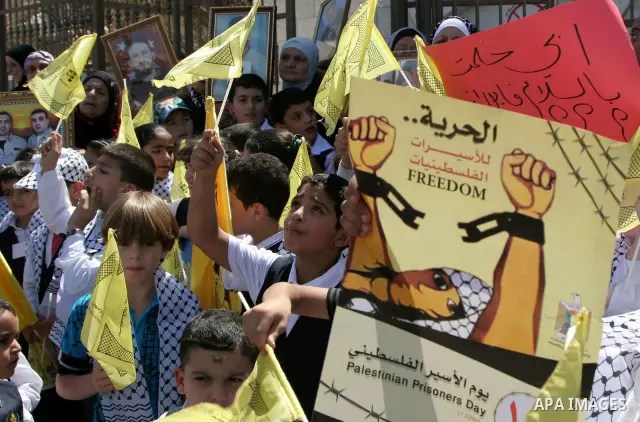 Palestinian women and children protest calling for the release of their relatives from Israeli jails, on Sept. 19, 2010, in the northern Israeli occupied West Bank city of Nablus . More than 7,000 Palestinians, including...