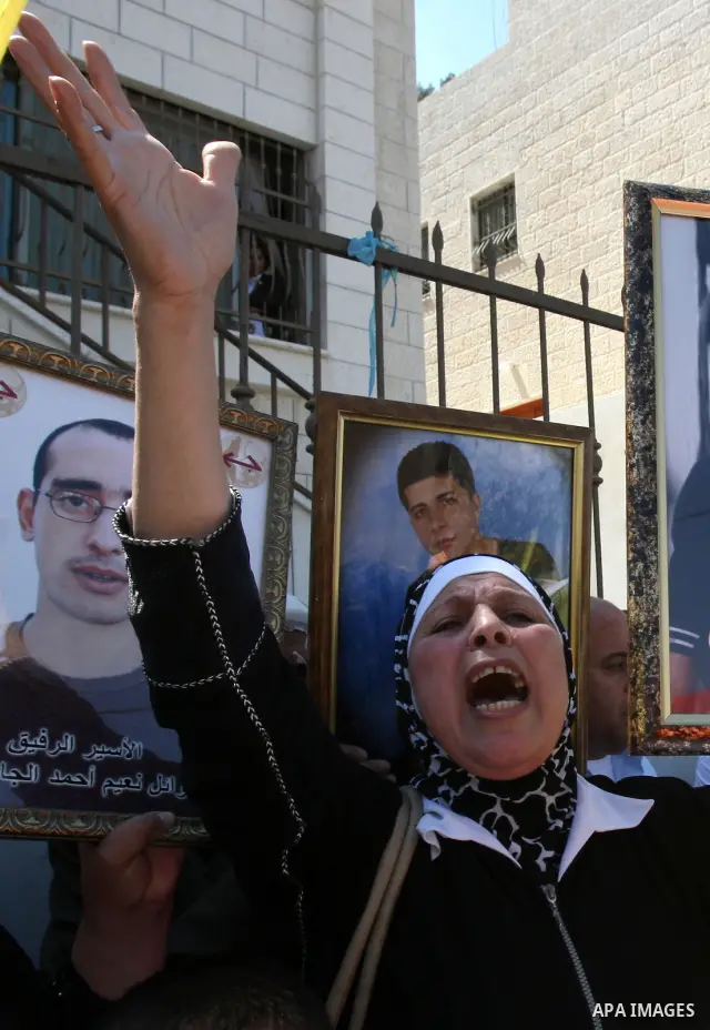 Palestinian women and children protest calling for the release of their relatives from Israeli jails, on Sept. 19, 2010, in the northern Israeli occupied West Bank city of Nablus . More than 7,000 Palestinians, including...