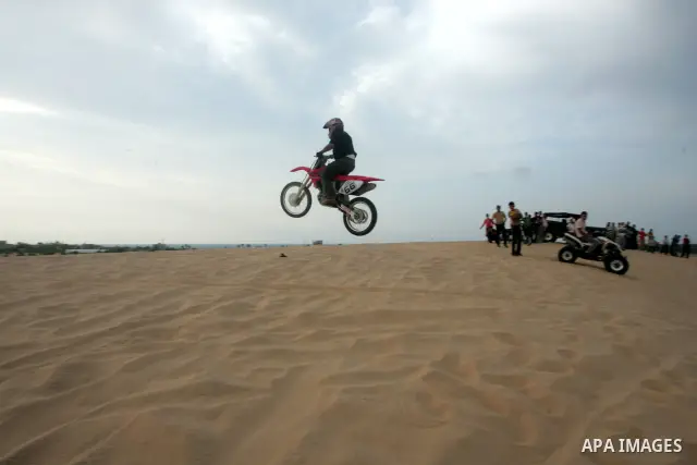 Palestinians ride their motorcycles as part of their weekend activities in the southern Gaza Strip city of Rafah on September 24, 2010. Hundreds of Palestinians spend their free time in the southern part of Gaza Strip ri...